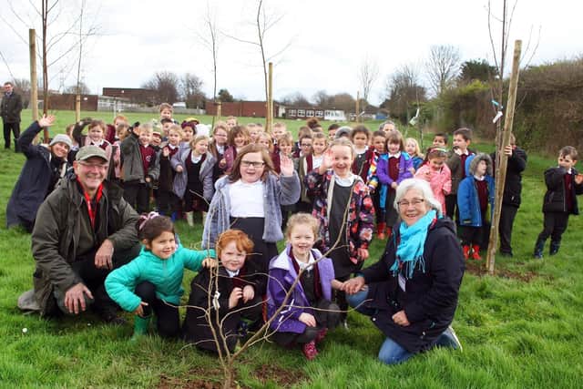 Julie Groves, Clive Gravett and Eunice Kenward with Eastbrook Primary Academy pupils in the new woodland during the tree planting. Picture: Derek Martin DM2022716a
