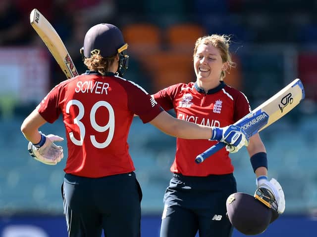Heather Knight cellebrates her ton with Nat Sciver. Picture by Getty Images