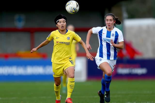 Ji So-yun of Chelsea (left) battles with Maya Le Tissier of Brighton and Hove Albion in the WSL