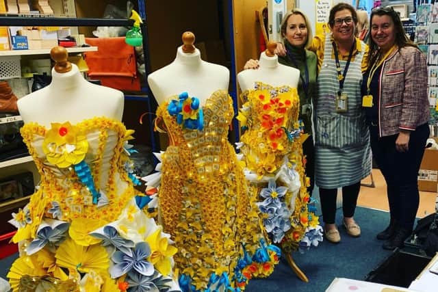 Jane Green, assistant head of design technology at Davison High School, and technician Louise Poland with Marie Curie charity shop manager Lisa Sleight