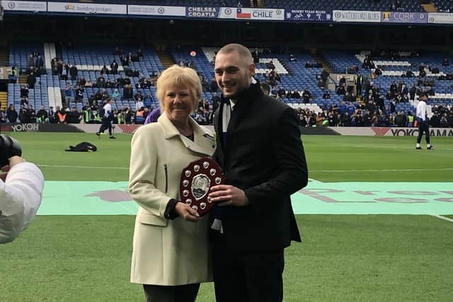 George Carroll receives his award at Stamford Bridge