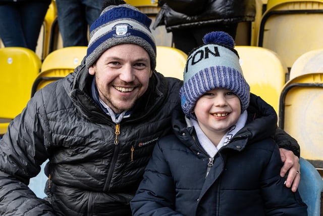 Two happy PNE supporters in the away end at Peterborough