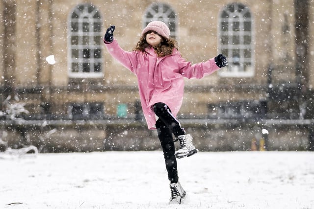 An eight-year-old girl dances in the snow in York