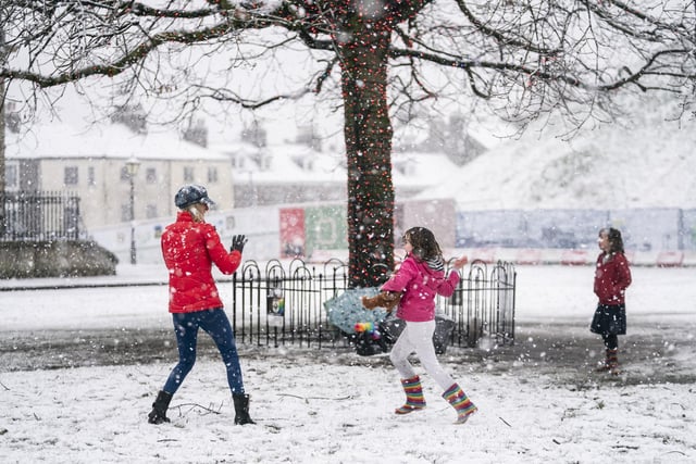 A family enjoy a snowball fight in York