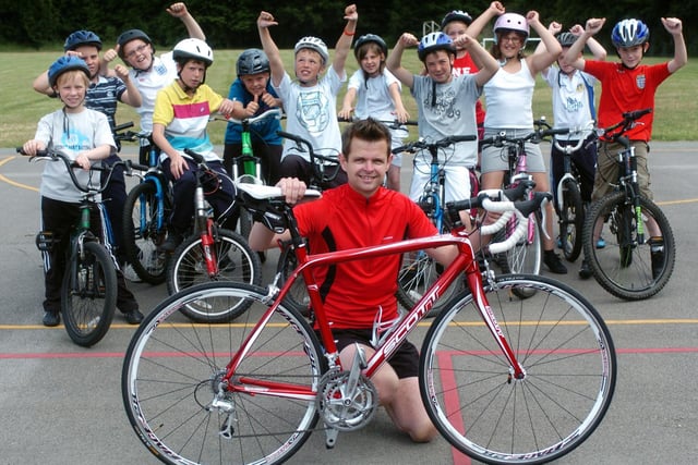 Allerton Bywater Primary School headteacher Nathan Atkinson is cheered on by his pupils as he prepares for the Eurostar City Triathlon.