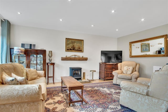 A stove adds the cosy factor to this reception room within the property.