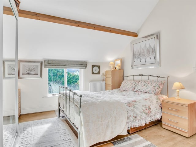 This attractive room looks out over the gardens
