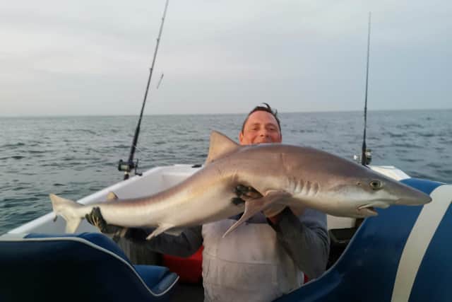 Daniel Rawlins holding the Tope Shark he caught