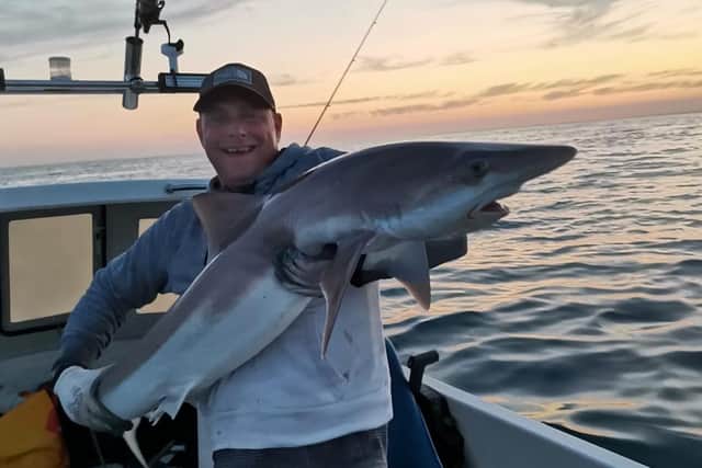 Daniel Rawlins holding the Tope Shark