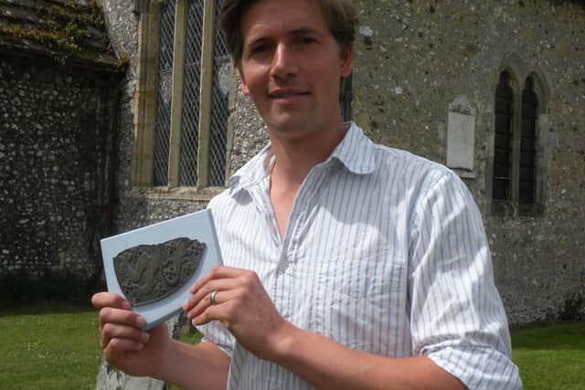Richard Goring in 2010 with the missing piece of brass shield. Picture: Hannah Marsh