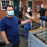 Landlord Matt Palmer of The Sportsman pub in Goddards Green and some of his staff ahead of reopening. Picture: Steve Robards