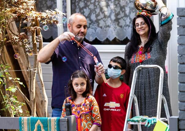Capturing Lockdown - The Khan family in Broadfield. Photo by Woodard Photography