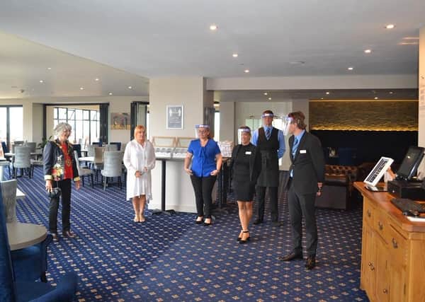 Bexhill Mayor with staff at Cooden Beach Hotel SUS-200807-124551001