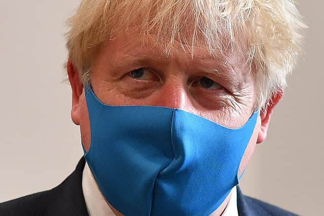 Boris Johnson wearing a mask (Photo by Ben Stansall-WPA Pool/Getty Images)
