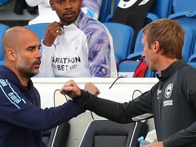 Brighton and Hove Albion head coach Graham Potter with Man City manager Pep Guardiola