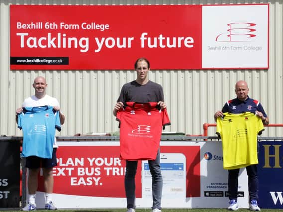 Socially distsnced? Well, hes almost one Peter Crouch tall! Borough centre-back Steve James models the new first-team shirt, sponsored by Bexhill College, with Academy director Sean Noble (left) and first-team manager Danny Bloor (right)