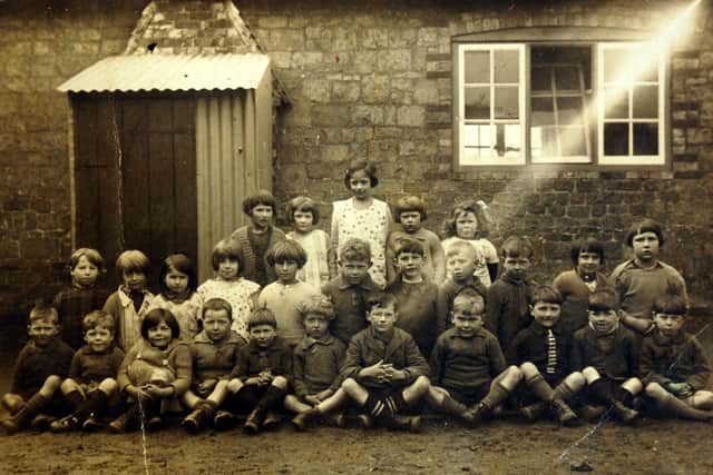Irene Hawkins is sitting in the top row, second left, in this picture at Fittlleworth School in 1930