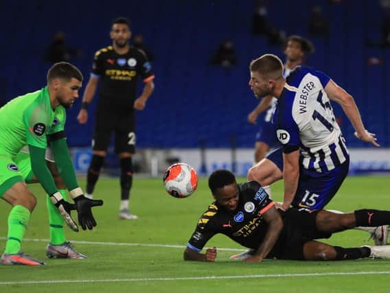 Brighton defender Adam Webster insists the players 'are not on holiday' and must work hard to secure their Premier League status