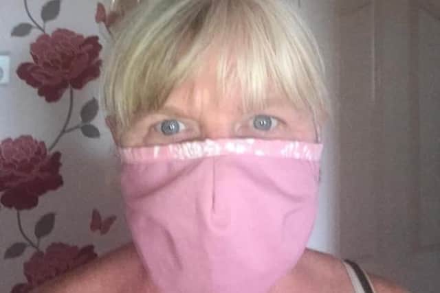 Eastbourne Herald's chief reporter Annemarie Field sporting a glamorous pink facial covering SUS-200716-162927001