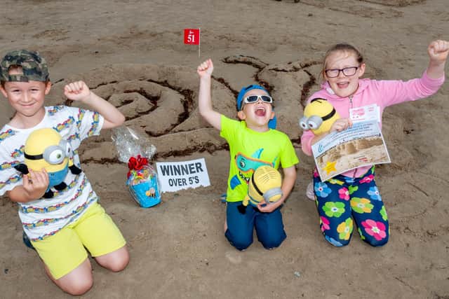 The Littlehampton Town Council Sandcastle Competition, 2019. Adam, Millie and Tom, winners of the over-5s category. Picture: Scott Ramsey