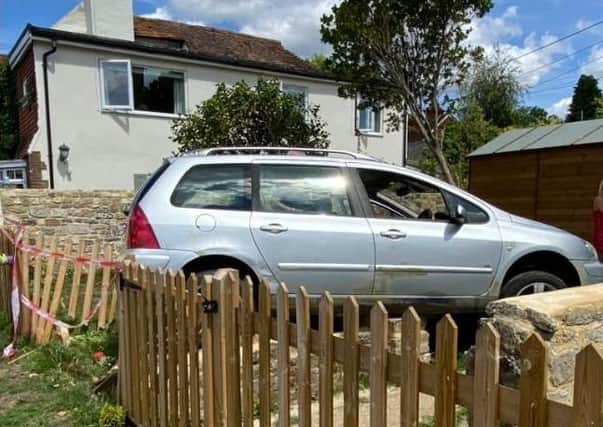 Firefighters were called to assist at Grove lane, Petworth after a vehicle left the road and ‘collided with a garden wall’ just after 11.50am on Monday (July 20). Photo: Midhurst Fire Station SUS-200720-143923001