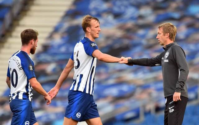BRIGHTON, ENGLAND - JULY 20: Graham Potter, Manager of Brighton and Hove Albion interacts with Dan Burn of Brighton and Hove Albion at full-time after the Premier League match between Brighton & Hove Albion and Newcastle United at American Express Community Stadium on July 20, 2020 in Brighton, England. Football Stadiums around Europe remain empty due to the Coronavirus Pandemic as Government social distancing laws prohibit fans inside venues resulting in all fixtures being played behind closed doors. (Photo by Glyn Kirk/Pool via Getty Images) SUS-200720-211529001
