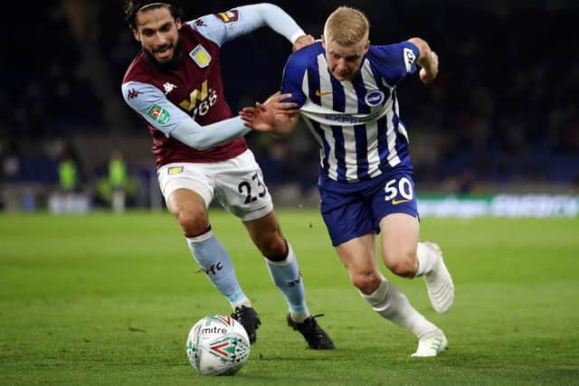 Alex Cochrane in action for Brighton against Aston Villa in the Carabao Cup last September