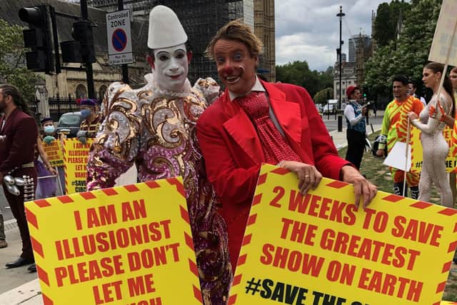 Clown duo Paul Carpenter, who appears as Popol the clown, and Kriss Freear, who appears as Kakehole the clown, protesting in Westminster