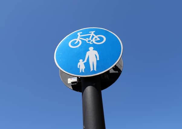 AYLESBURY, ENGLAND - MAY 21: Detailed view of a pedestrian and cyclist sign on May 21, 2020 in Aylesbury, United Kingdom . The British government has started easing the lockdown it imposed two months ago to curb the spread of Covid-19, abandoning its 'stay at home' slogan in favour of a message to 'be alert', but UK countries have varied in their approaches to relaxing quarantine measures. (Photo by Catherine Ivill/Getty Images) SUS-200806-134049001