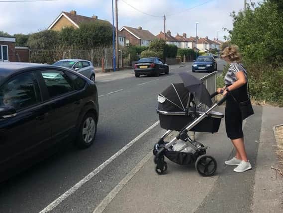Kristi Wallace trying to cross the busy Chichester Road in Selsey with a pram