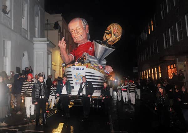 The Cliffe Bonfire Society's tableau depicting Sepp Blatter at the Lewes Bonfire 2015. Photograph by Simon Dack SUS-161031-182100001