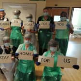 NHS staff at Eastbourne DGH with an important message at the start of the pandemic