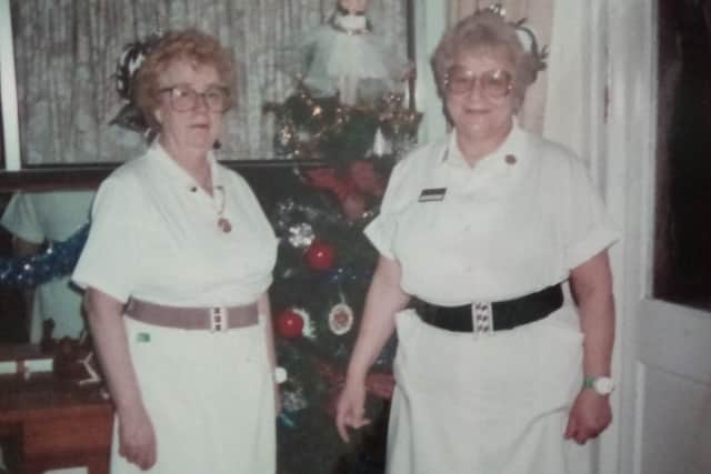 wo angels by the Christmas tree, Doris Wells and Ann Graysmark, who were great friends as nurses at Swandean Hospital in Worthing