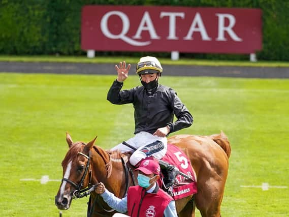 Frankie Dettori indicates how many Goodwood Cups Stradivarius has won following today's triumph / Picture: Alan Crowhurst for Getty