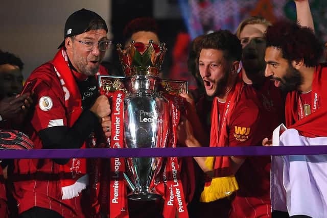 Adam Lallana lifts the Premier League title