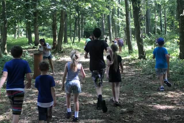 Walking in the woods during the Family Support Work teddy bears' picnic held at Warnham Park last year