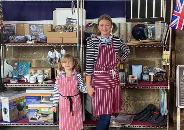 Gilly Barwick with little helper Hetty at the farm gate sale