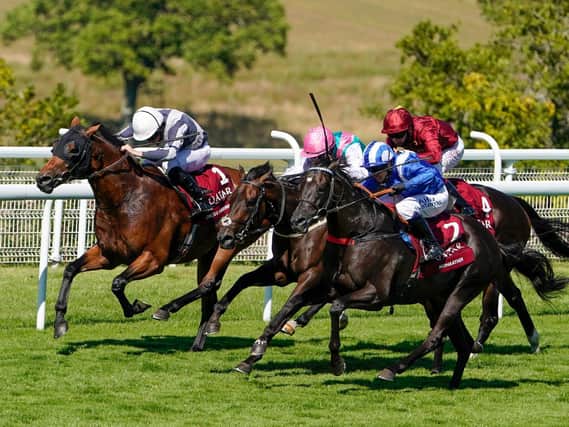 Mohaather and Jim Crowley, near side, time the run perfectly on the way to winning the Qatar Sussex Stakes / Picture: Getty, Alan Crowhurst