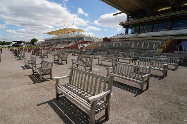 The careful placing of benches was just one of the jobs Goodwood staff had spent two weeks doing to prepare the venue for a 5,000 crowd / Picture: Alan Crowhurst, Getty