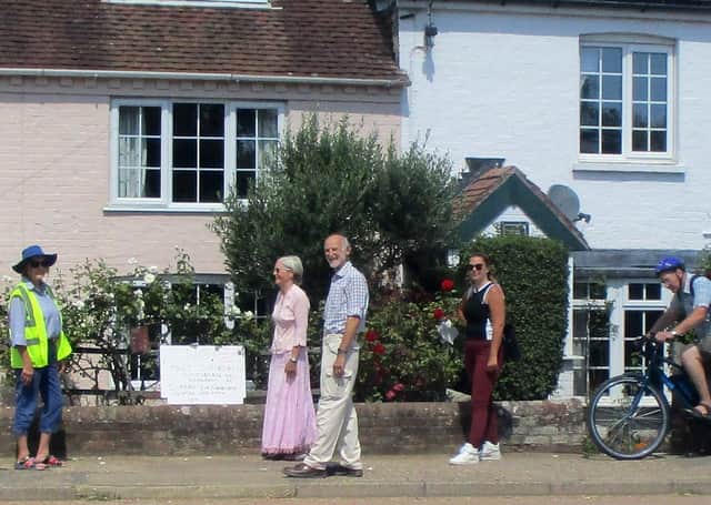 In Fishbourne, residents met on the A259 in the Village outside a cottage, displaying signs asking for pavements to remain dedicated safe spaces for pedestrian use. SUS-200508-150639001
