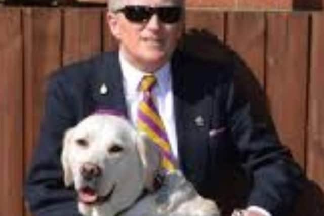 Alun Elder-Brown with his guide dog Bonnie SUS-200308-160202001