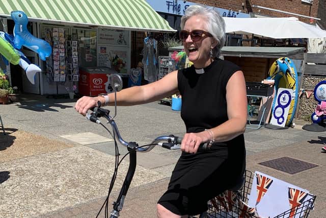 Emma Ham-Riche, curate of St Mary’s Church, has a go on the trusty trike