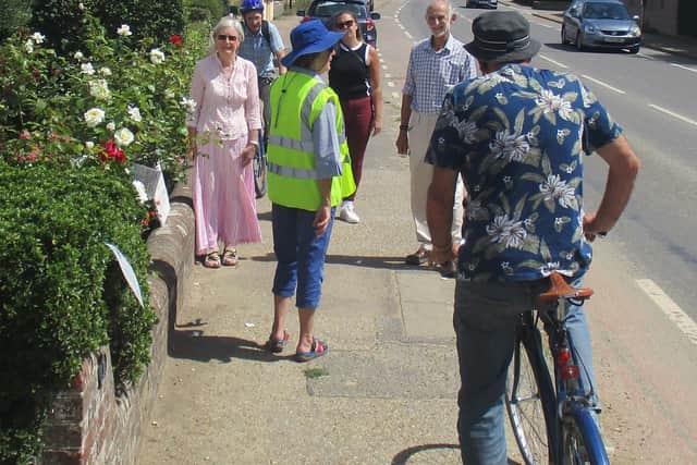 In Fishbourne, residents met on the A259 in the Village outside a cottage, displaying signs asking for pavements to remain dedicated safe spaces for pedestrian use. SUS-200508-150628001