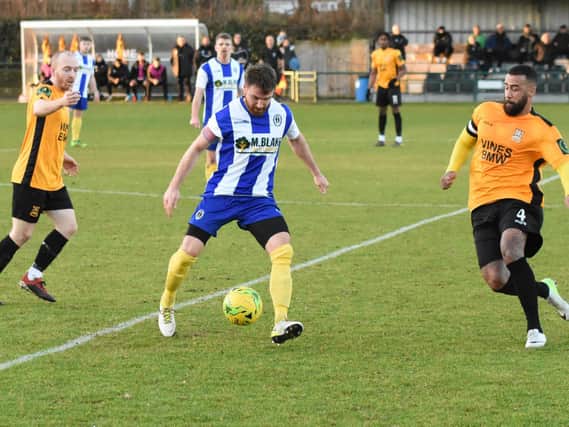 Lloyd Cotton on the ball for HHTFC against Three Bridges / Picture by Grahame Lehkyj
