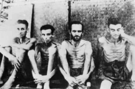 Four emaciated PoWs at Tarsoa Hospital - Chris believes the man second left is her father