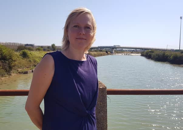 Green Party campaigner Emily O'Brien in Newhaven - an area she says has already been 'deeply damaged'  by East Sussex County Council policy and which stands to lose out further