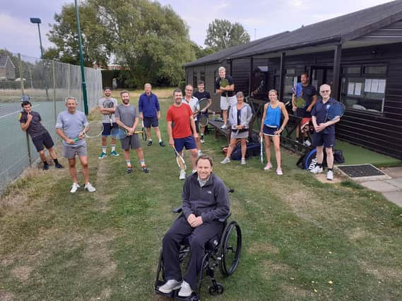 Darren Triggs is greeted by tennis pals at Fishbourne TC