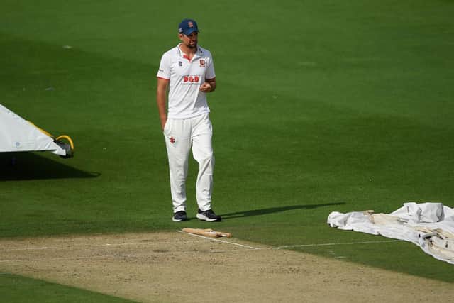 Sir Alastair Cook inspects the pitch as the weather improves / Picture: Getty
