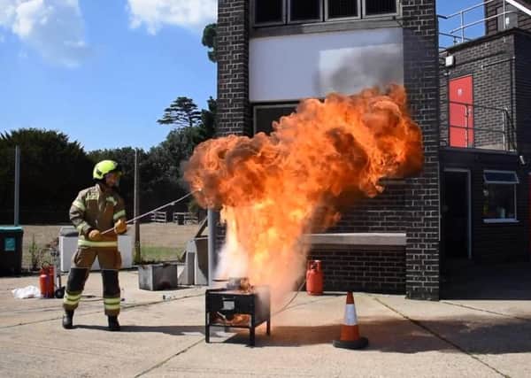 Worthing Fire Station crew show what happens when you put water on a hot fat pan fire