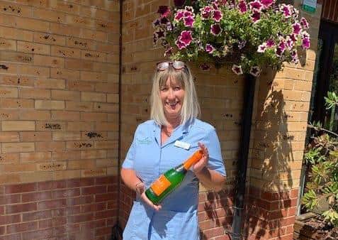 Amanda Smith was presented with flowers and a bottle of prosecco at a celebration to mark her achievement